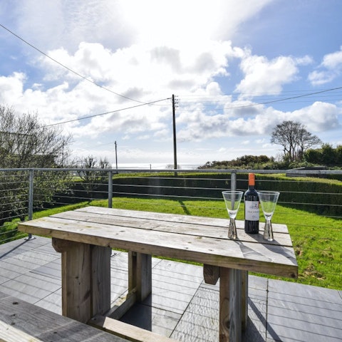 Make the most of the sunny weather at the picnic table in the private garden