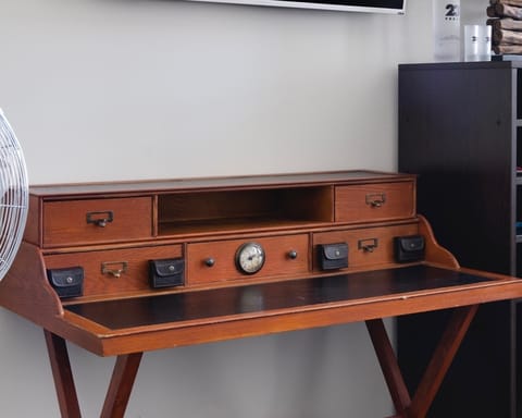 Catch up on work emails  from the vintage-style bureau