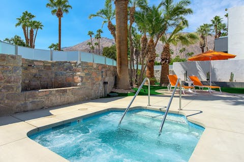 Watch the sunset from the bubbles of the shared hot tub