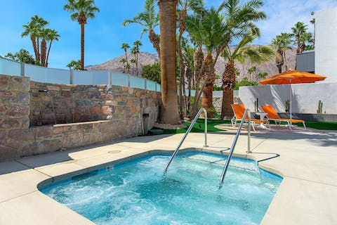 Watch the sunset from the bubbles of the shared hot tub