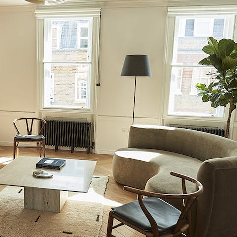 Relax in style on mid-century furniture bathed in plenty of natural light