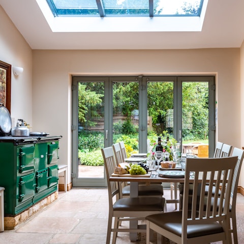 Come together for lazy mealtimes in the sun-drenched dining space