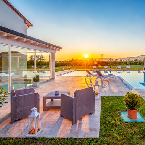 Share a special moment with a loved one while sitting on the patio, taking in the breath-taking sunset