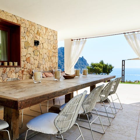Linger over a Mediterranean dinner spread in the shady outdoor dining room
