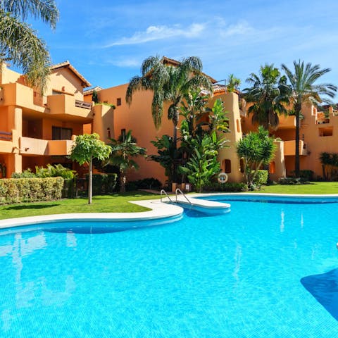 Lounge in the sun by the communal swimming pool, and cool off with a dip
