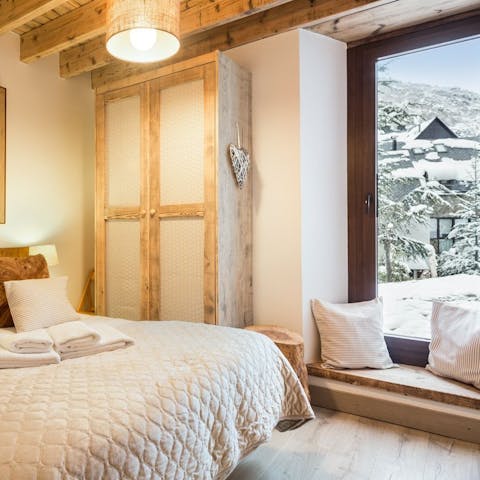 Wake up to the sight of snow falling out of the bedroom window