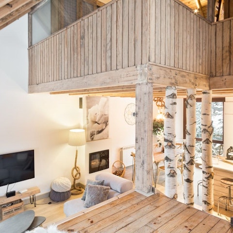 Snuggle up next to the fireplace in the open-concept living area