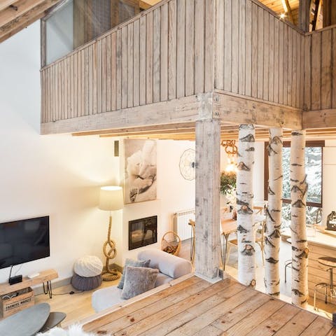 Snuggle up next to the fireplace in the open-concept living area