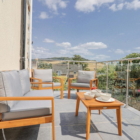 Relax on the terrace and enjoy stunning views of the coast and sea
