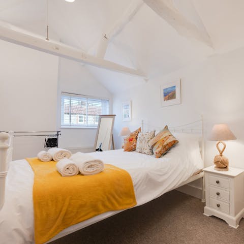 Drift off into a deep sleep in your comfortable king-size bed
