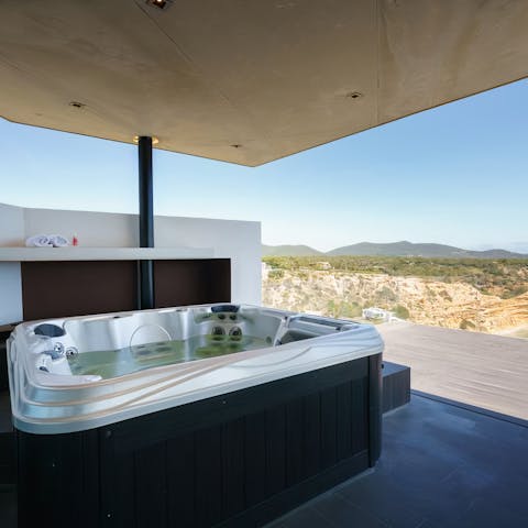 Sink into the hot tub on the upper terrace with a glass of rosé