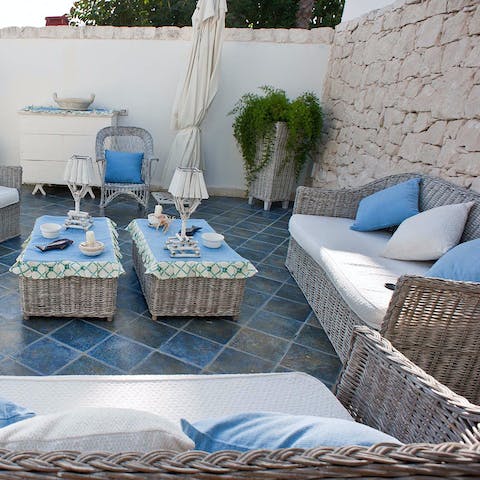 Pop open a bottle of fizz and relax on the terrace as the sun sets