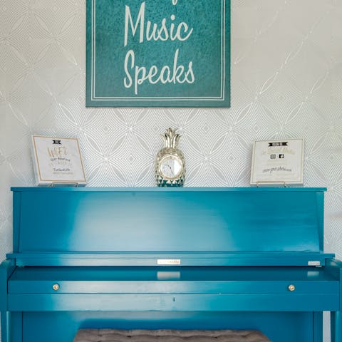 A bright teal piano