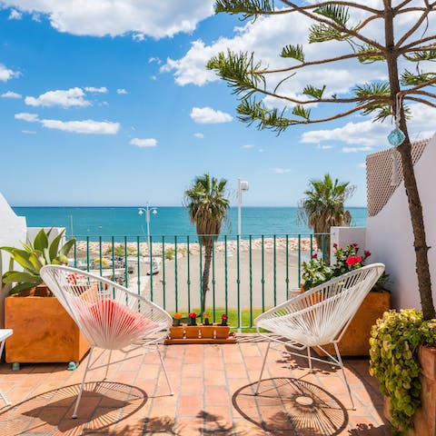 Watch the Mediterranean glisten in the distance from the master bedroom's balcony