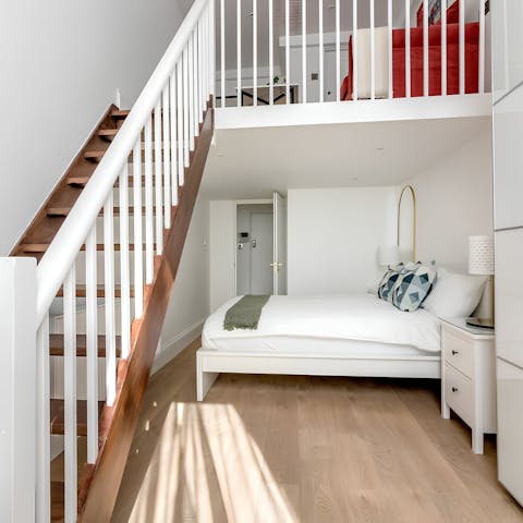 Bunk in with a friend or family in this flexible bedroom with a mezzanine space