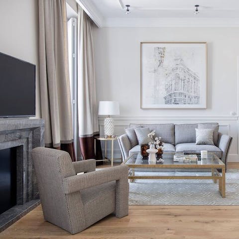 Cosy up for an evening of movies and wine in the stylish living room