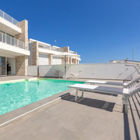 Soak up the Italian sun from in or beside the private pool