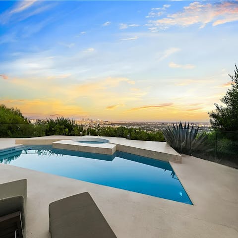 Take in the stunning Los Angeles views from the pool at sunset