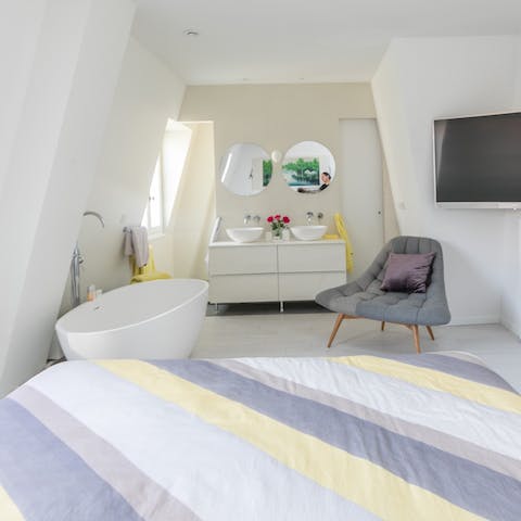 Relax and unwind at the end of the day in your chic bathtub in the bedroom