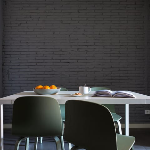 Have breakfast in style beside the painted brick walls