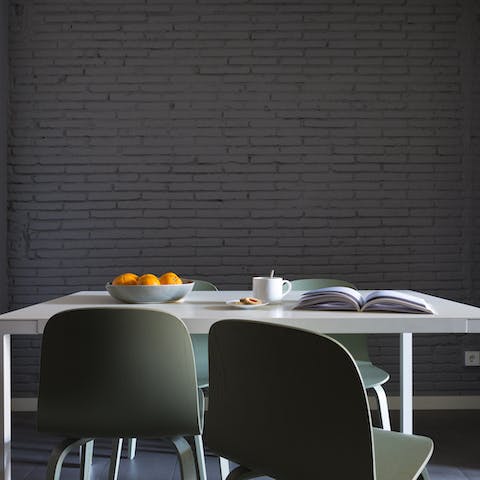 Have breakfast in style beside the painted brick walls