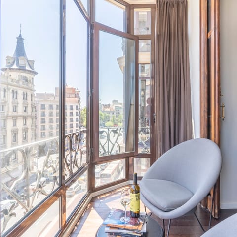 Pour some wine and watch the world go by from the sunny alcove