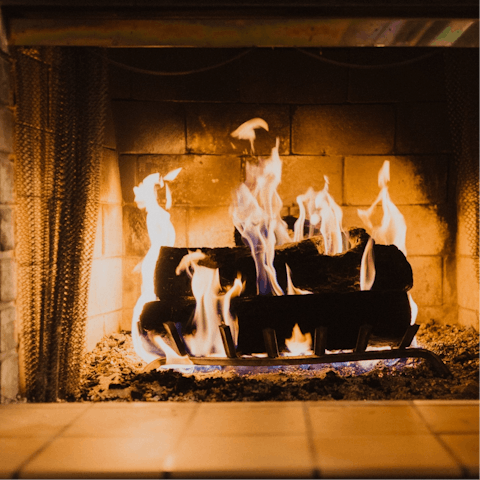 Spend evenings curled up by the warm glow of the wood-burning stove