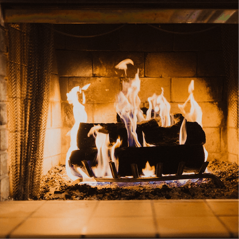 Spend evenings curled up by the warm glow of the wood-burning stove