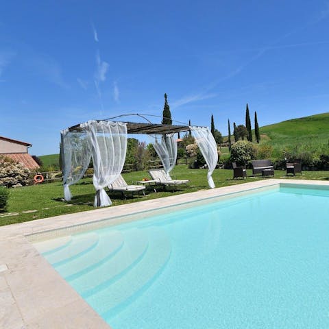 Swim in the private pool as nature surrounds you