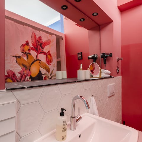 The hot pink bathroom walls