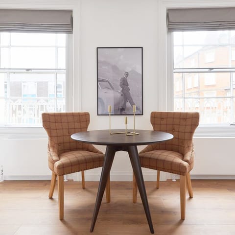 Sip your morning cup of tea at the elegant table while the light pours in through the large windows