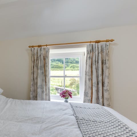 Wake up to pretty green scenes each morning from the king-sized bed