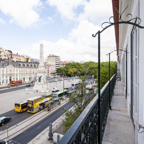 Enjoy your morning pastel de nata from the balcony overlooking Praça dos Restauradores