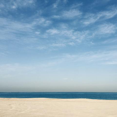 Sunbathe on the on-site private beach