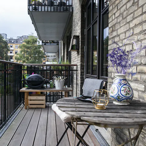 A balcony with a BBQ