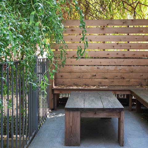 Unwind over a glass of wine in the cosy outdoor seating area