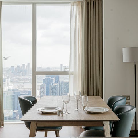 Dine in the sky thanks to the home's floor-to-ceiling windows