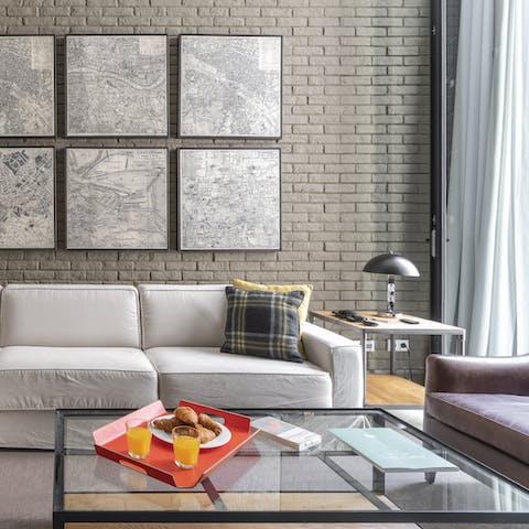 Kick back in the living room, bathed in natural light from big windows