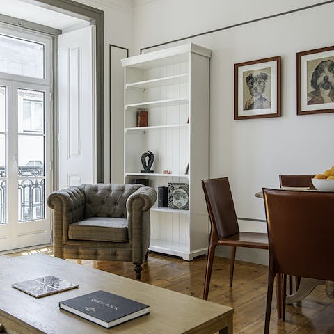 Relax among the coffee table books and canine portraits in the luminous living room
