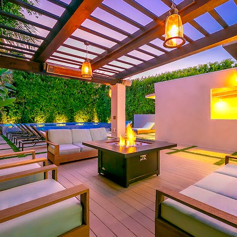 Cosy up around the fire pit as night falls