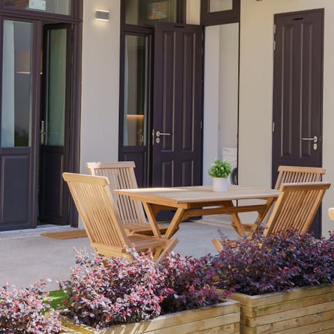 Spend mealtimes in the sunny private garden