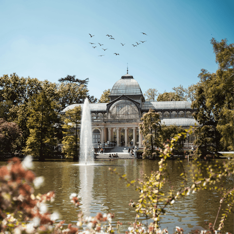 Take a stroll around El Retiro Park, fifteen minutes away