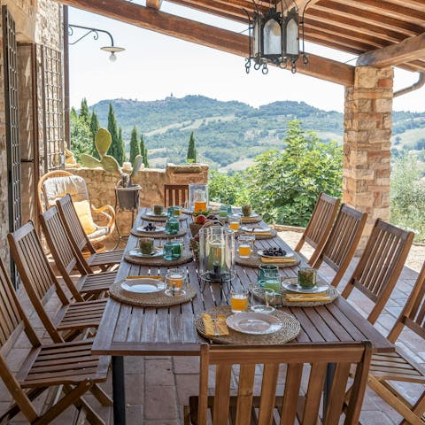 Enjoy a glass of Italian red wine under the dappled shade of the pergola