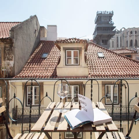 Open some Portuguese wine to sip on the private balcony in the evening