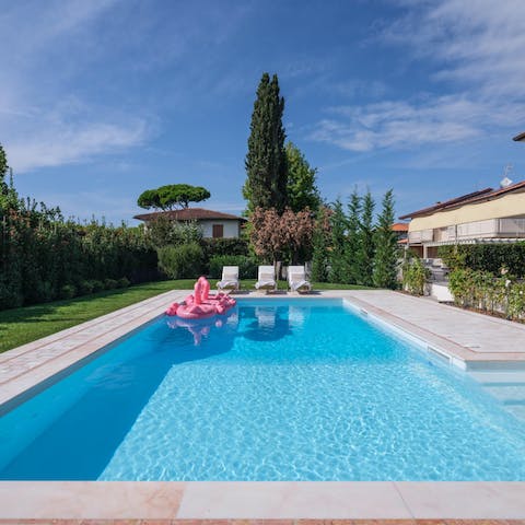 Spend the afternoon snoozing on a lounger by the swimming pool