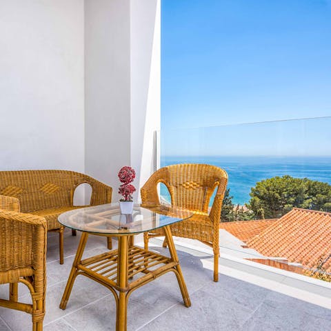 Take your coffee to the balcony to drink in the sea views