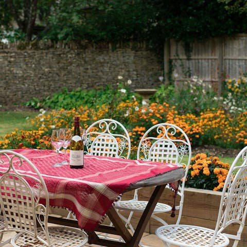 Uncork a bottle of wine to toast a fabulous holiday in the beautiful garden