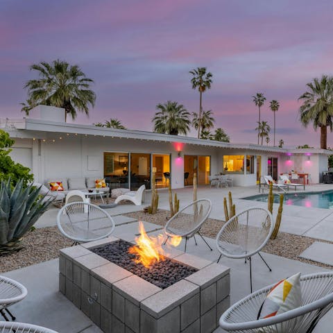 Gather around the fire pit and relax by the pool as the sun sets