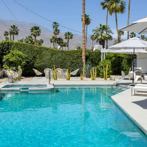 Cool down in the private pool or get cosy in the hot tub with mountain views