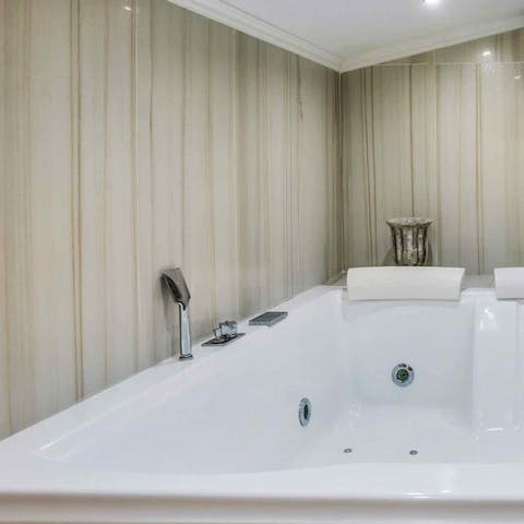 End the day with a soothing soak in the jacuzzi tub